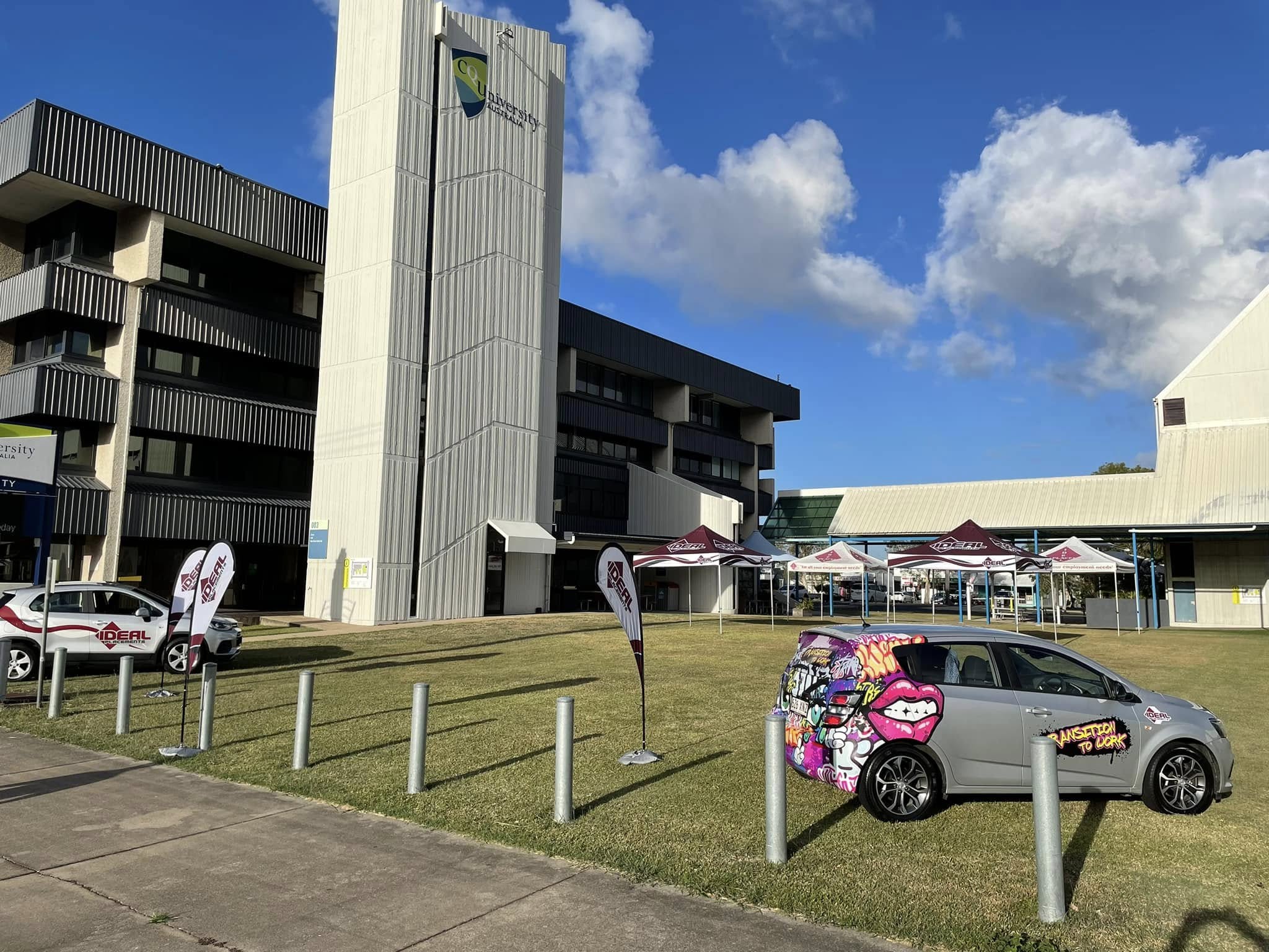 IDEAL Placement branded vehicles parked outside University of Australia campus building